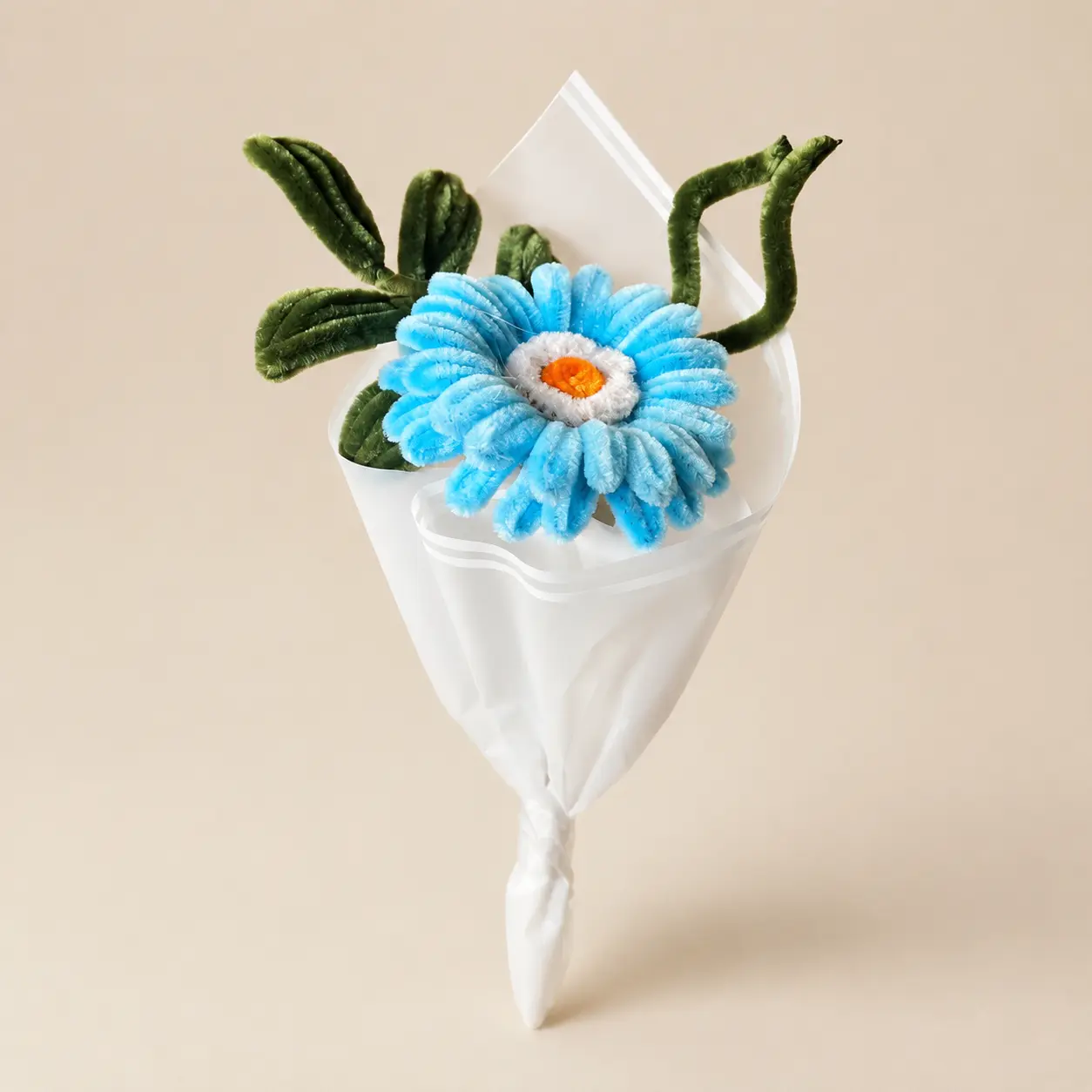 One soft blue daisy, simply wrapped.