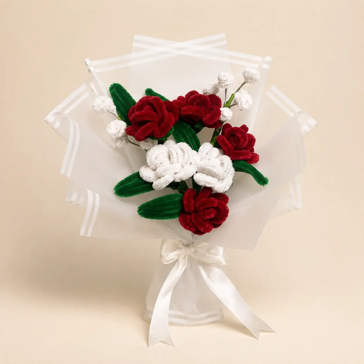 Red and white handmade roses in luminous wrapping.