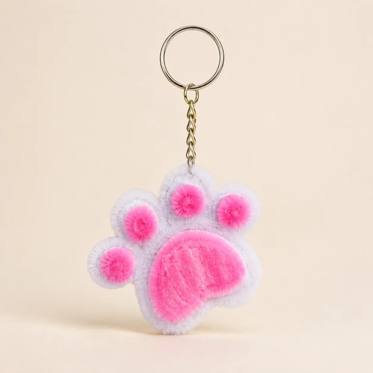 Pink and white handmade paw keychain