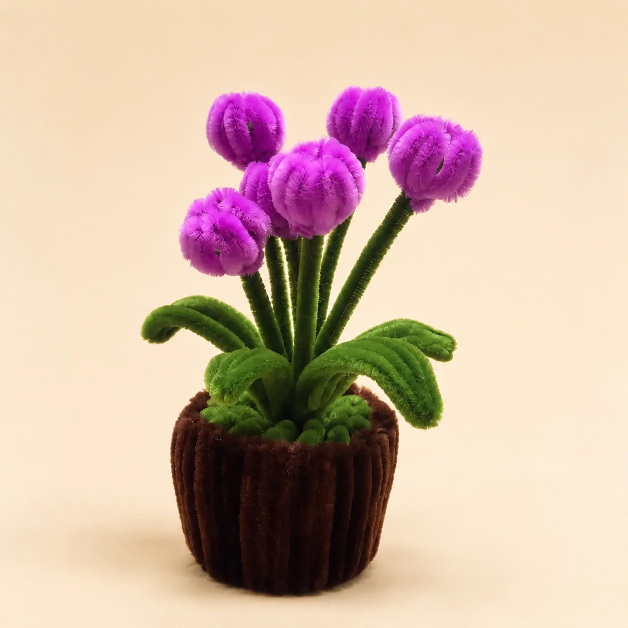 A purple handmade flower pot